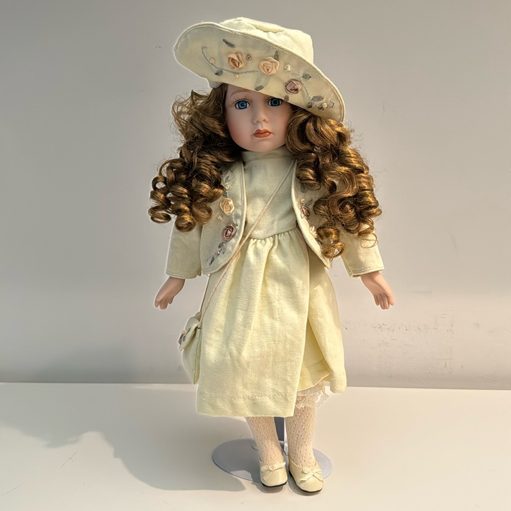 GORGEOUS DOLL WITH CURLS, BLUE EYES AND PEACHES AND CREAM FACE WITH STAND